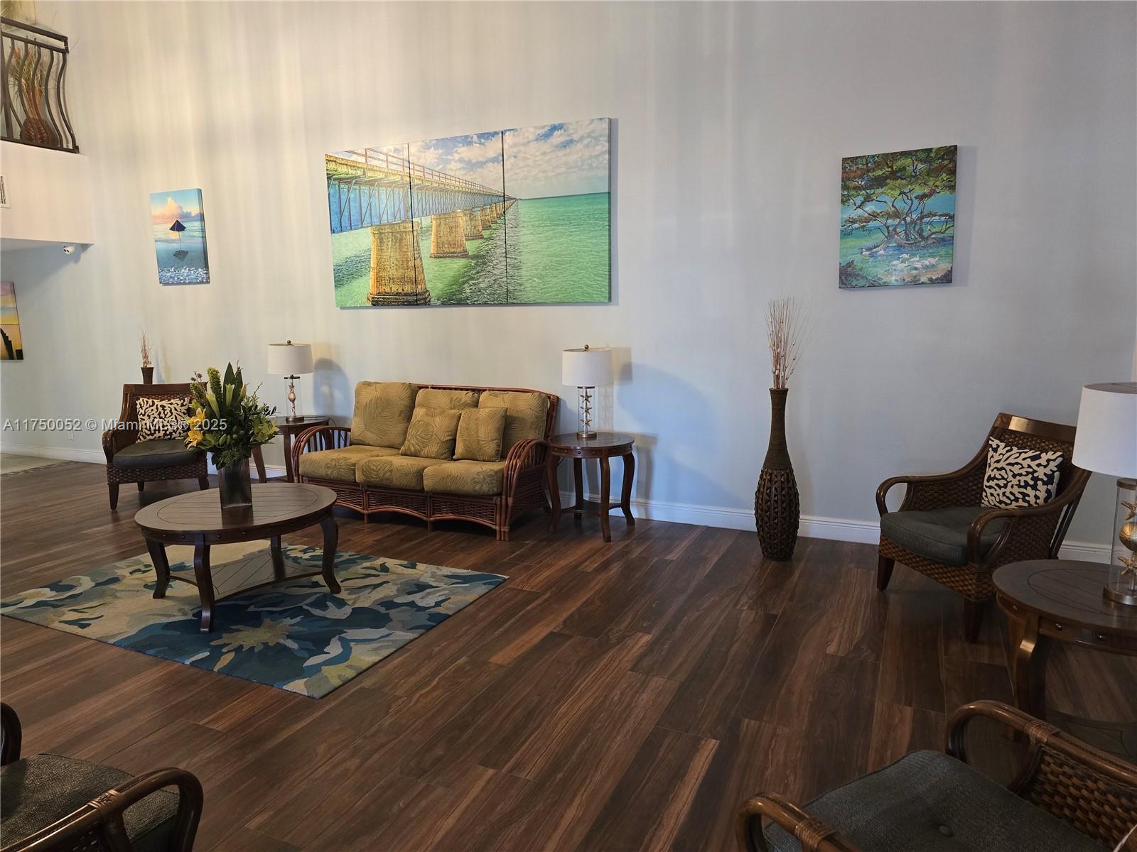 1505 North Riverside Drive, Unit 604 Pompano Beach, FL 33062 - Photo 11 of 50 a living room with furniture and a wooden floor