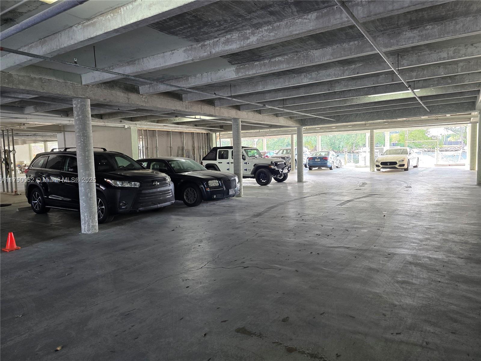 1505 North Riverside Drive, Unit 604 Pompano Beach, FL 33062 - Photo 14 of 50 a view of parking garage with cars