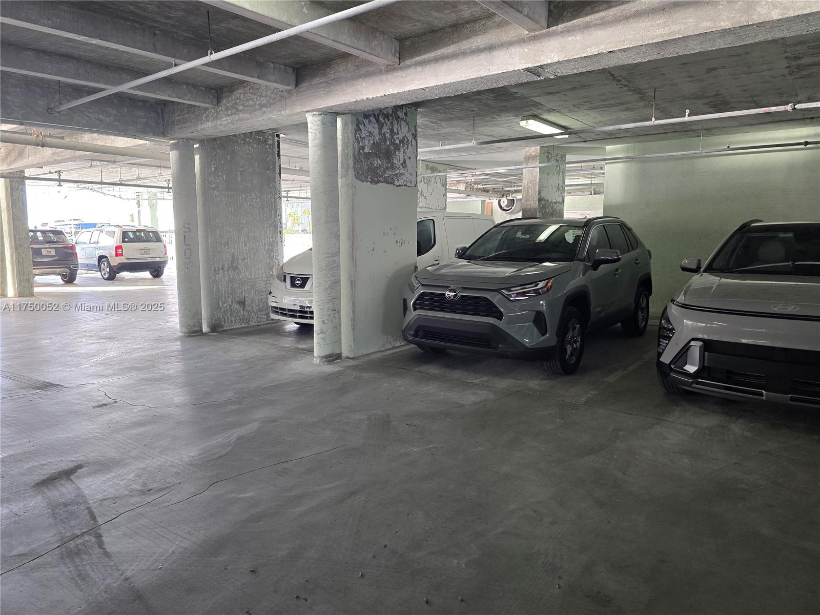 1505 North Riverside Drive, Unit 604 Pompano Beach, FL 33062 - Photo 15 of 50 a car parked in a parking garage