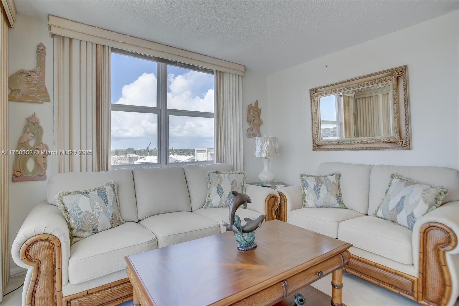 1505 North Riverside Drive, Unit 604 Pompano Beach, FL 33062 - Photo 22 of 50 a living room with furniture and a window