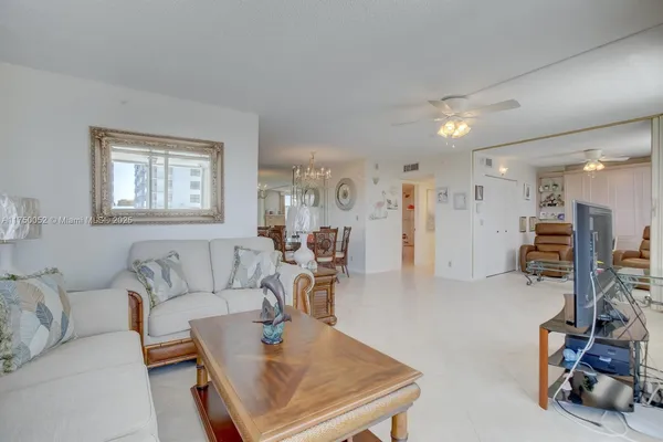 a living room with furniture and a chair