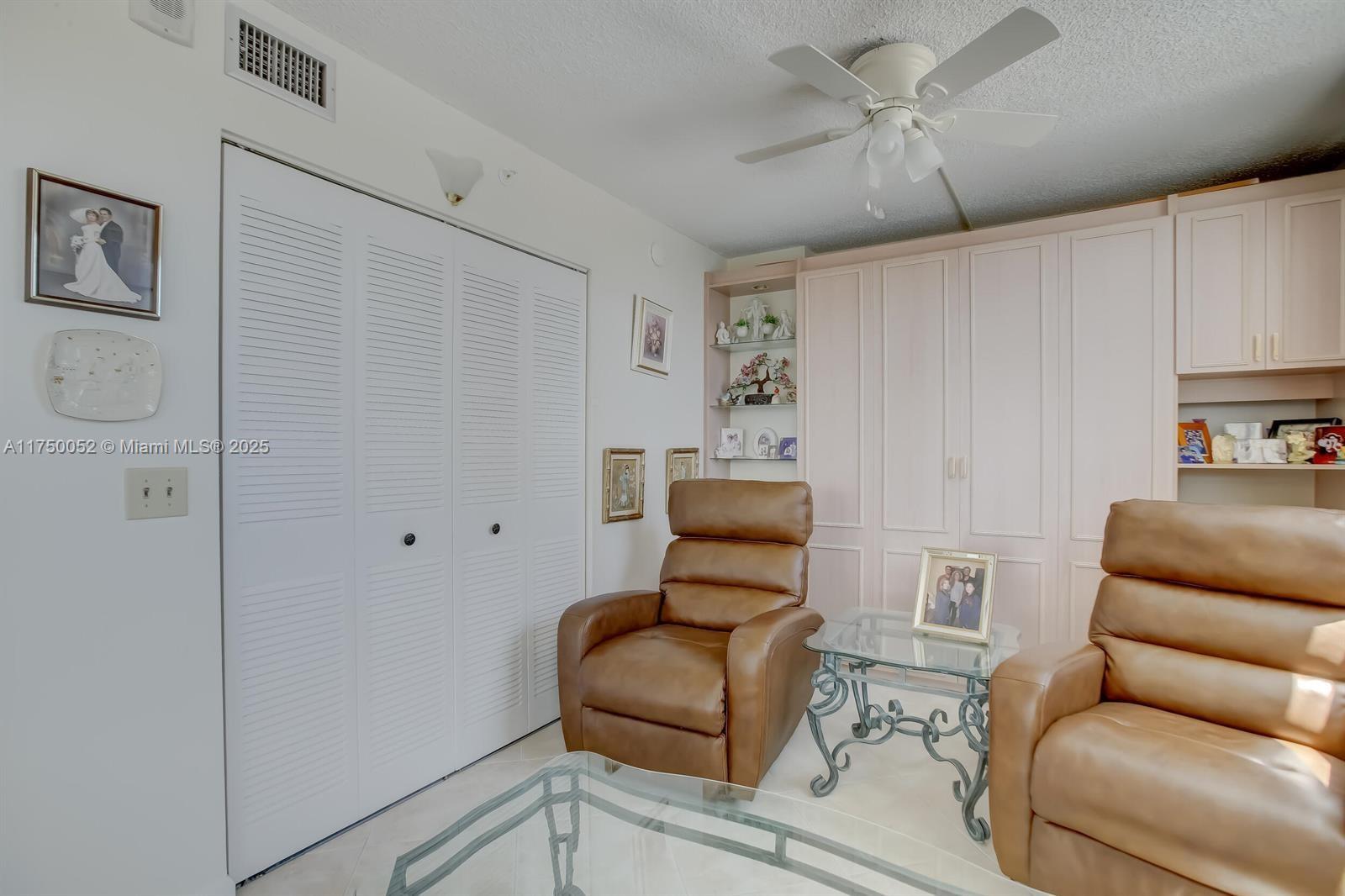 1505 North Riverside Drive, Unit 604 Pompano Beach, FL 33062 - Photo 25 of 50 a living room with furniture and a chair