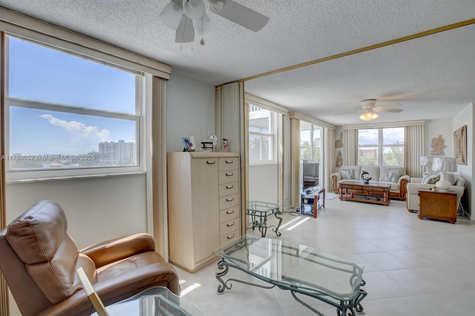 1505 North Riverside Drive, Unit 604 Pompano Beach, FL 33062 - Photo 27 of 50 a view of a livingroom with furniture and windows