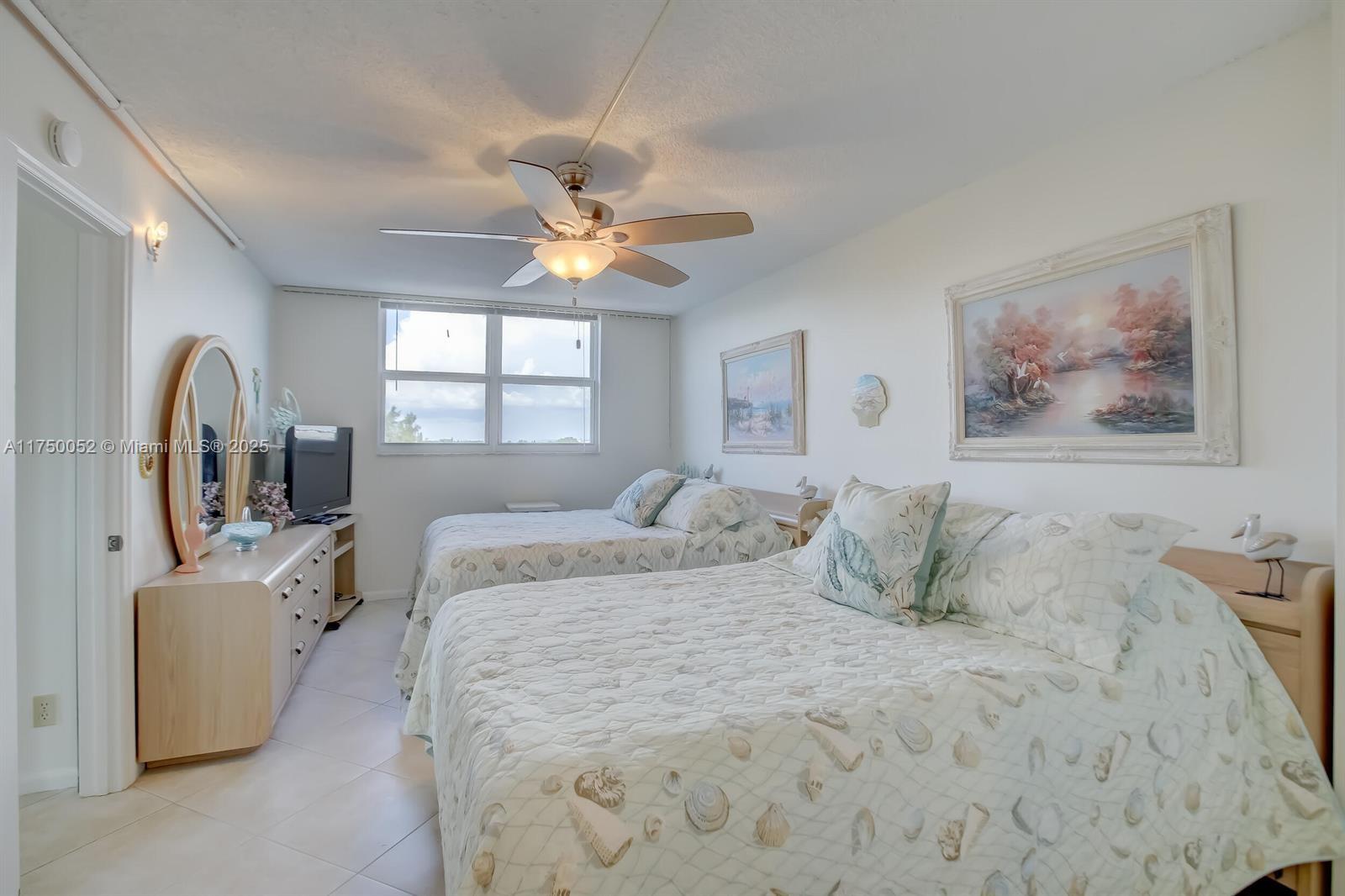 1505 North Riverside Drive, Unit 604 Pompano Beach, FL 33062 - Photo 32 of 50 a bedroom with a bed furniture and window