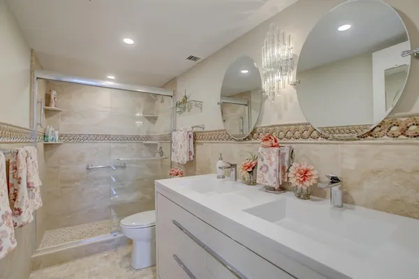 a living room with furniture windows and wooden floor