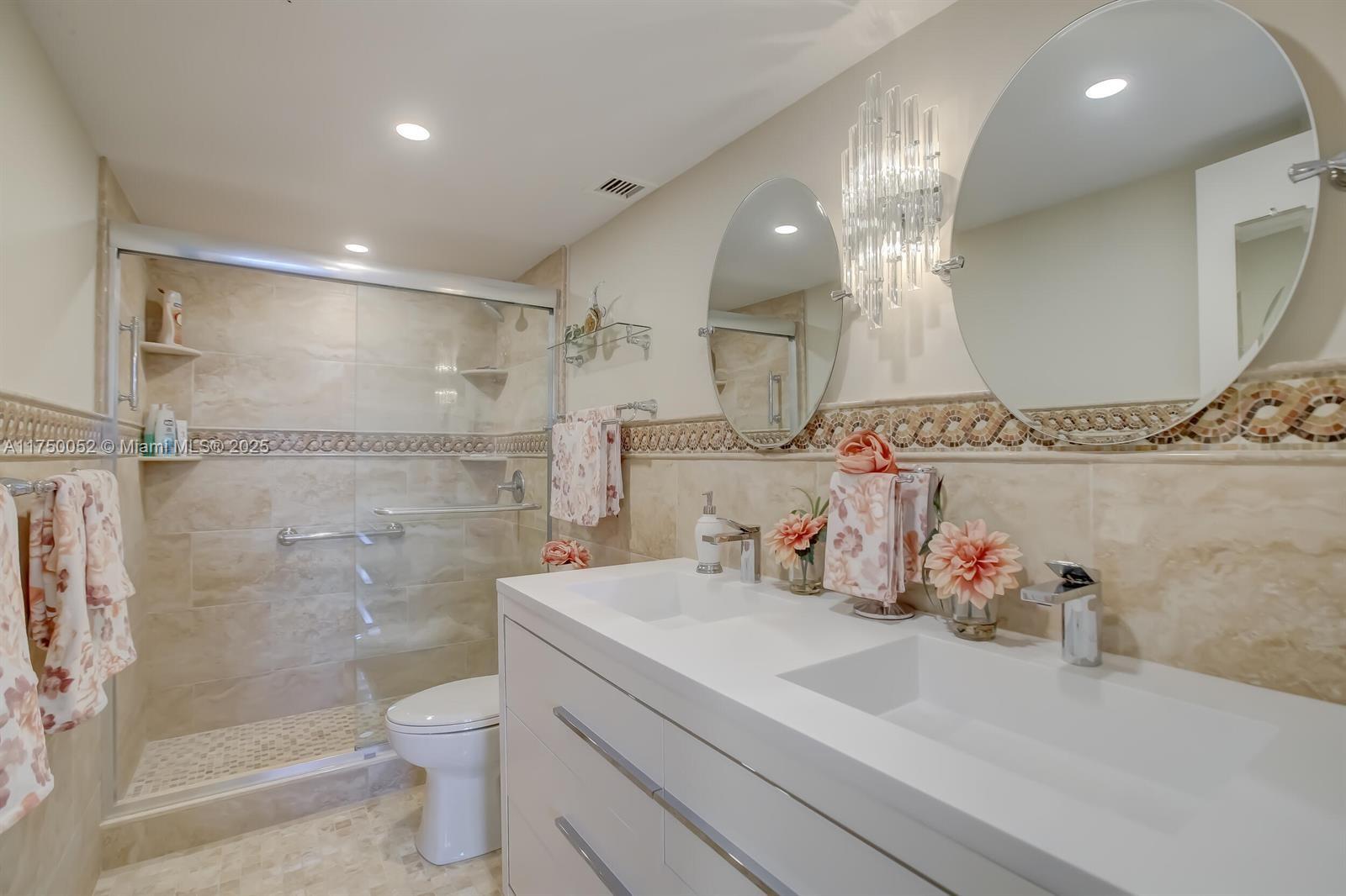 1505 North Riverside Drive, Unit 604 Pompano Beach, FL 33062 - Photo 34 of 50 a bathroom with a sink a toilet and shower