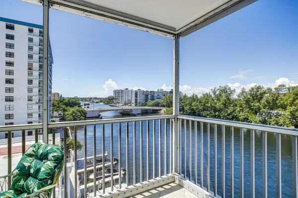 a view of a balcony with wooden floor