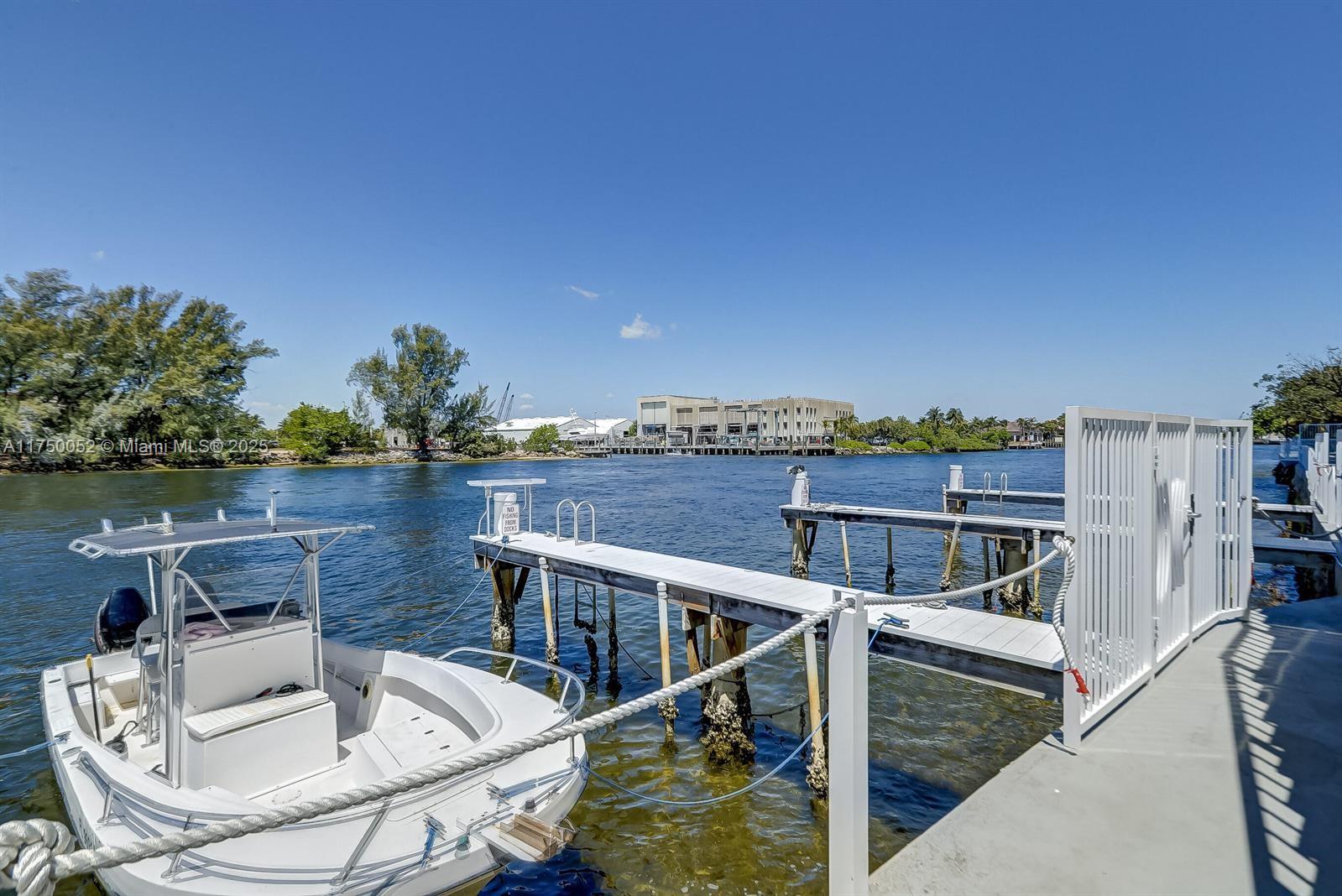 1505 North Riverside Drive, Unit 604 Pompano Beach, FL 33062 - Photo 47 of 50 a balcony with table and chairs