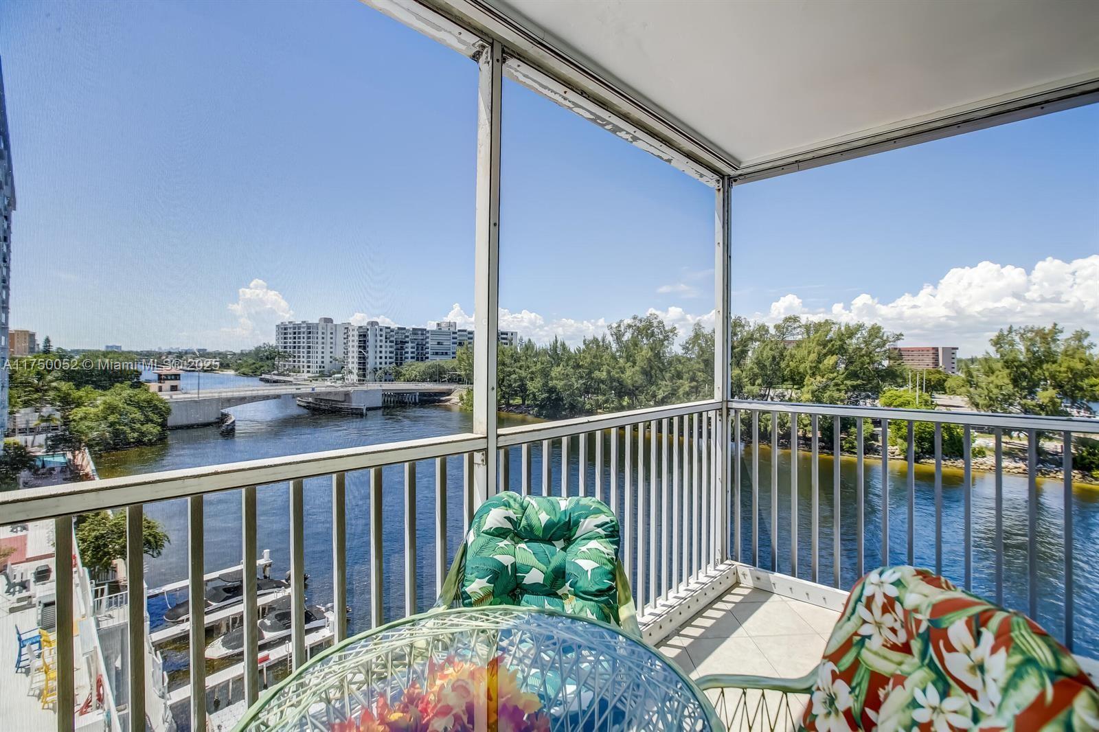 1505 North Riverside Drive, Unit 604 Pompano Beach, FL 33062 - Photo 5 of 50 a view of a balcony with wooden floor