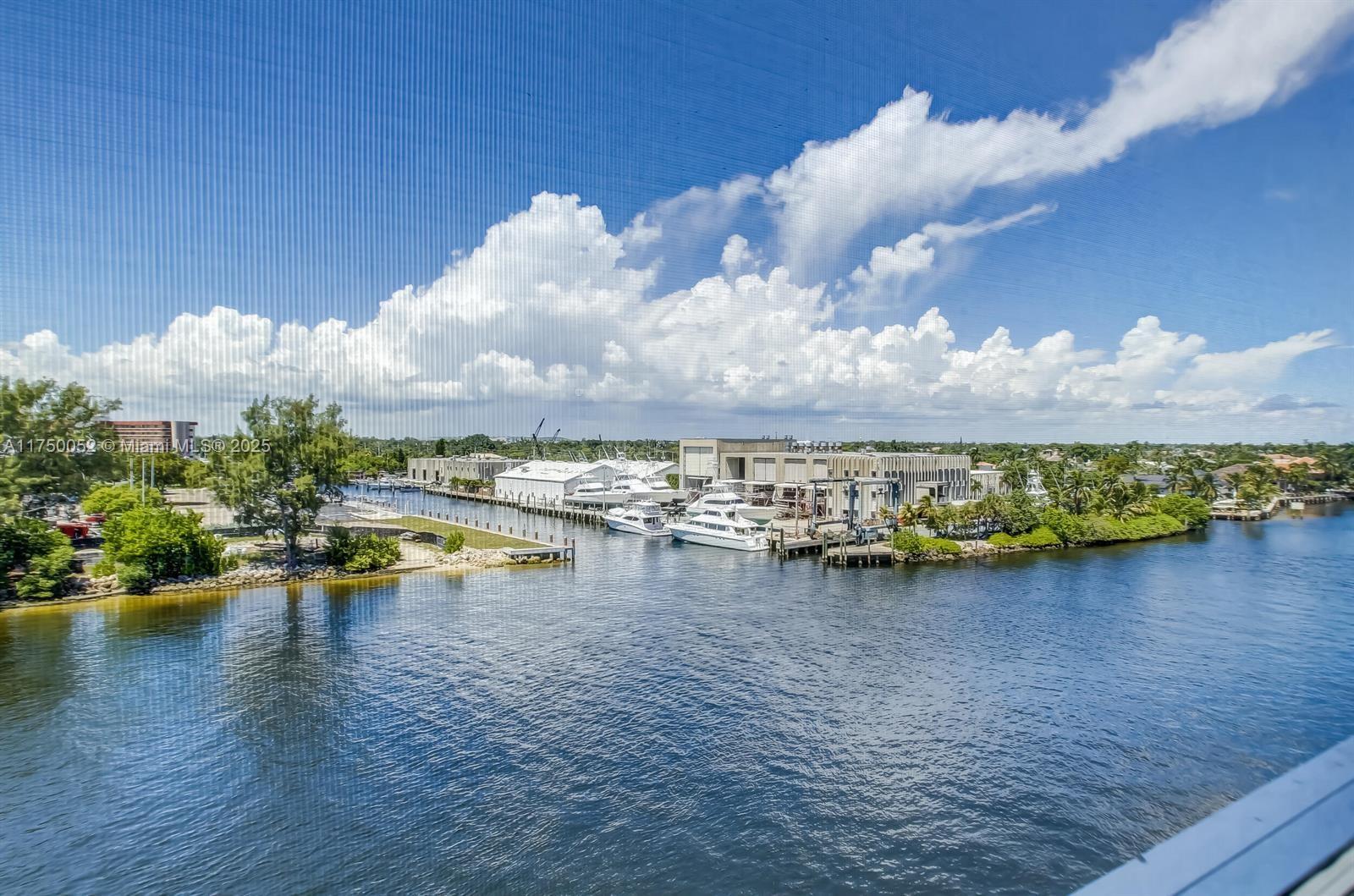 1505 North Riverside Drive, Unit 604 Pompano Beach, FL 33062 - Photo 7 of 50 a view of a lake with a nearby beach
