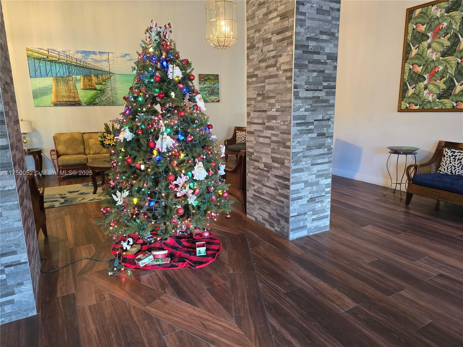 1505 North Riverside Drive, Unit 604 Pompano Beach, FL 33062 - Photo 10 of 50 a vase of flowers sitting on a wooden floor