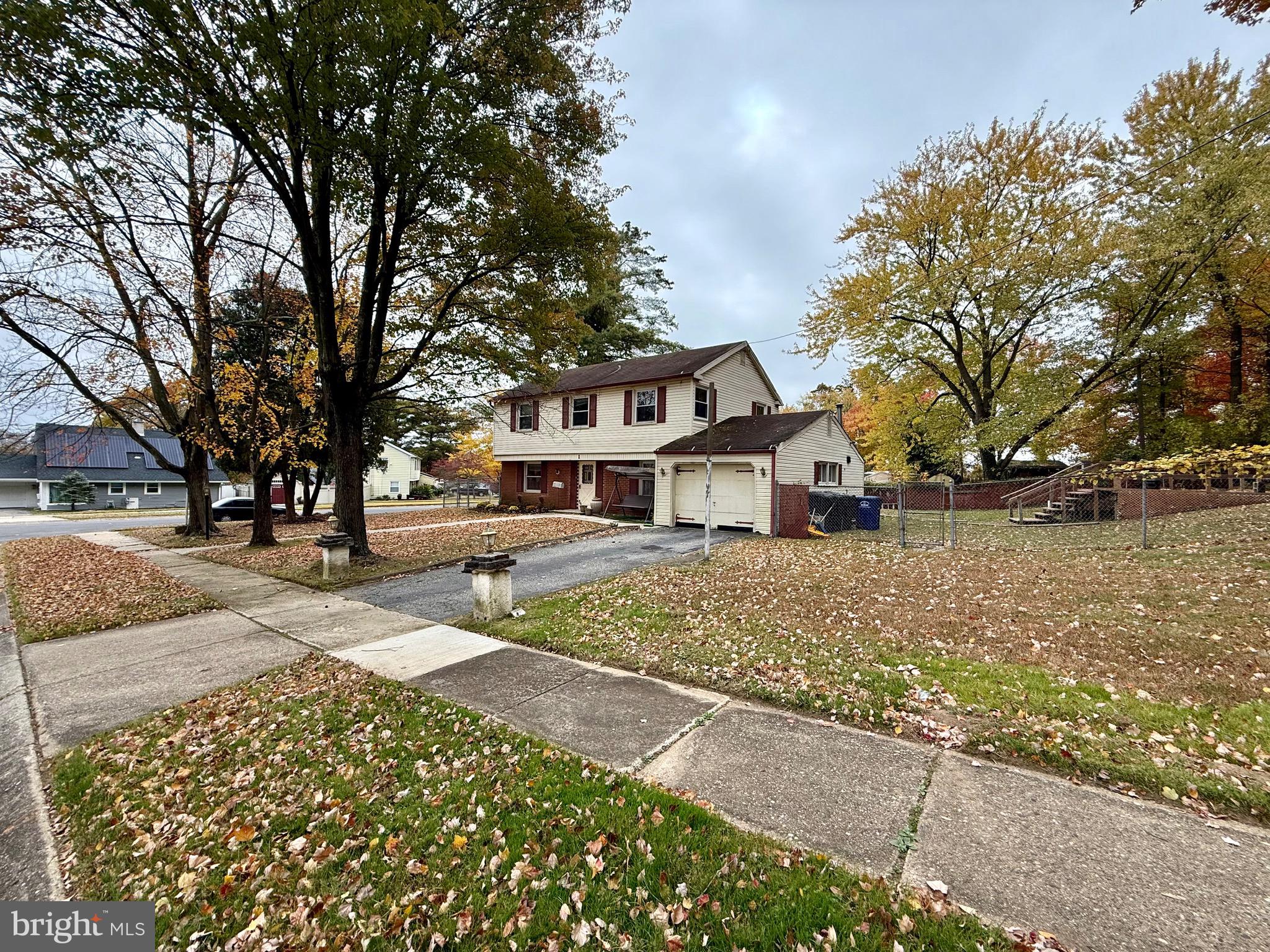 1 Mystic Way Willingboro, NJ 08046 - Photo 2 of 19 a front view of a house with a yard and large trees
