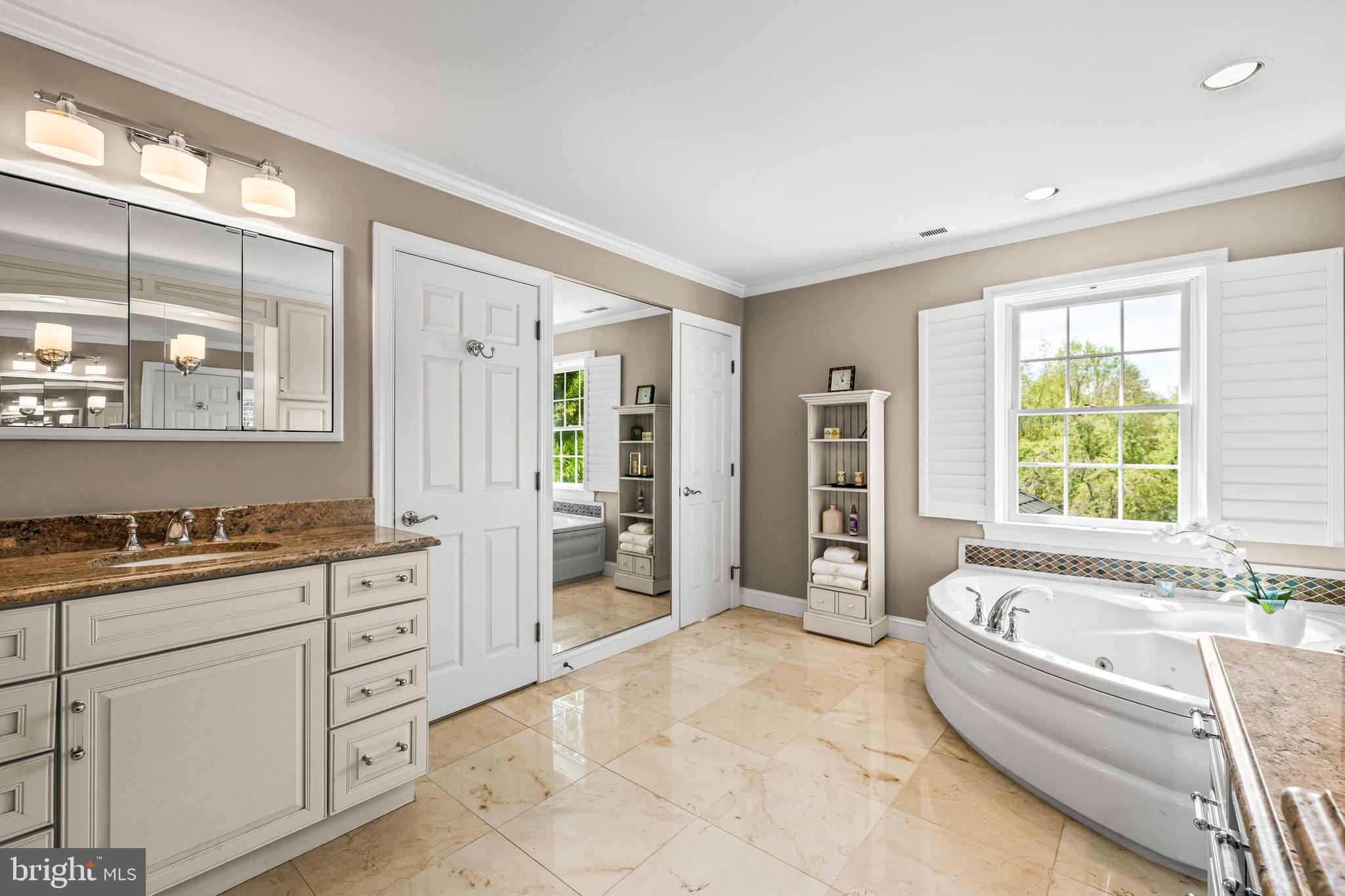 29 Springhill Farm Court Cockeysville, MD 21030 - Photo 51 of 84 a spacious bathroom with a granite countertop tub sink and mirror