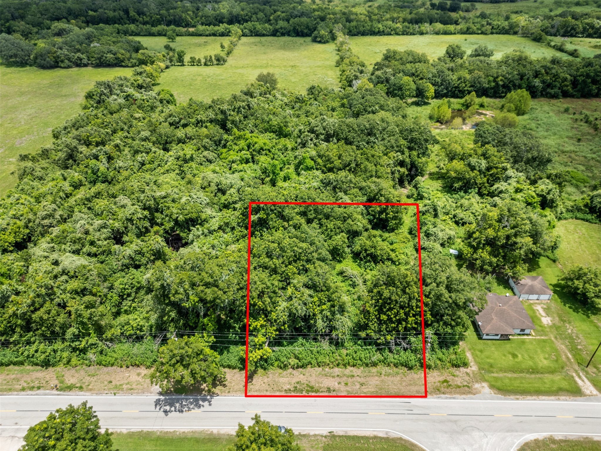 302 Farm To Market 524 Road Sweeny, TX 77480 - Photo 1 of 6 a view of a garden with an outdoor space