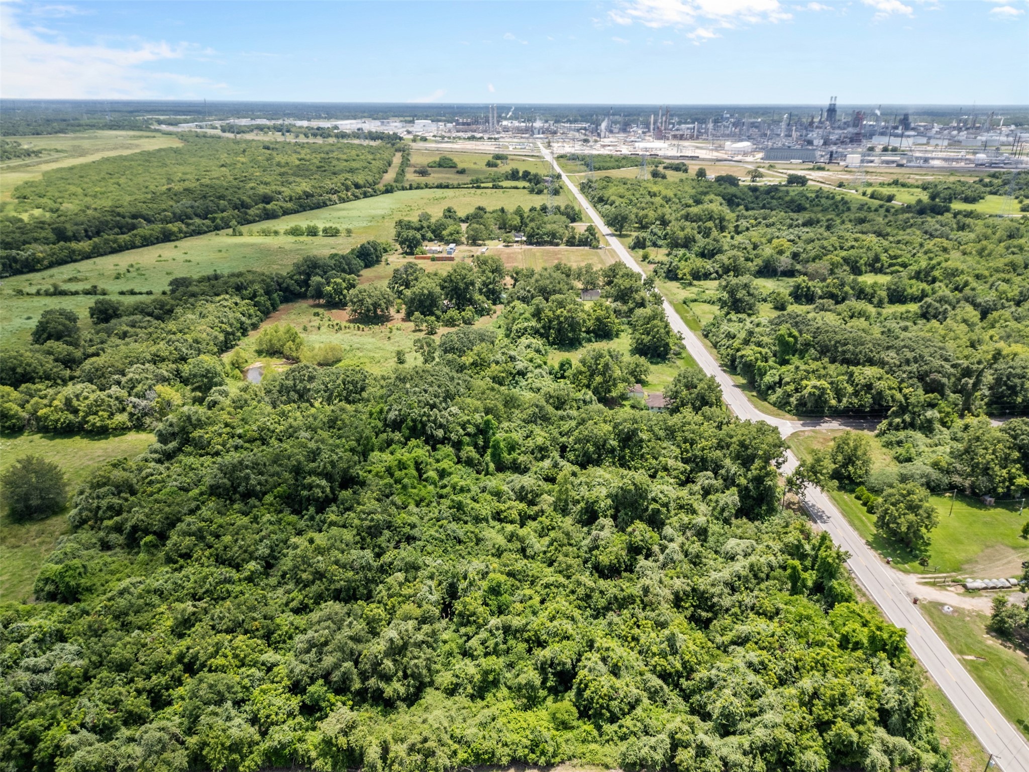302 Farm To Market 524 Road Sweeny, TX 77480 - Photo 6 of 6 an aerial view of residential houses with outdoor space and trees