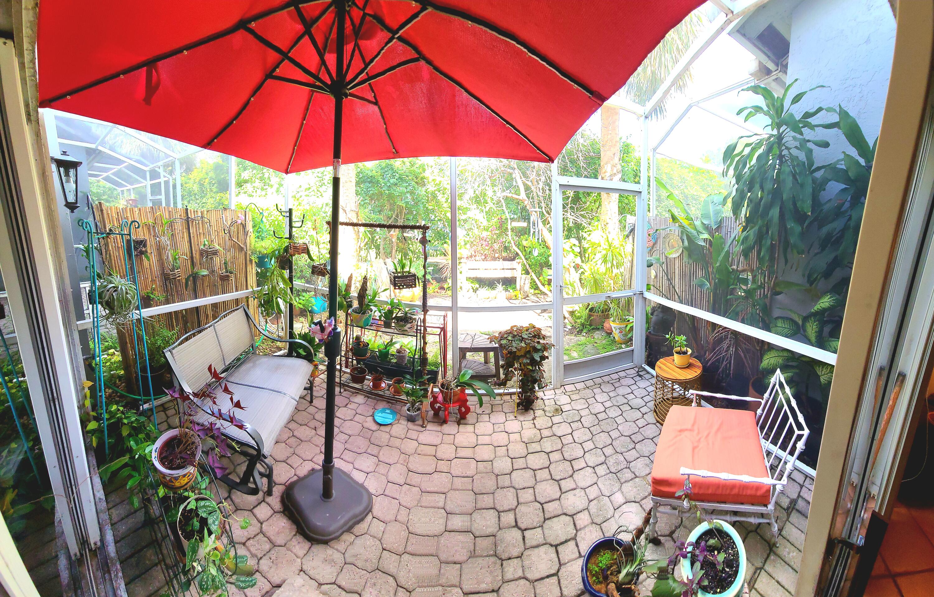 5121 Sabal Gardens Lane, Unit 2 Boca Raton, FL 33487 - Photo 13 of 25 a view of balcony with chairs and wooden floor