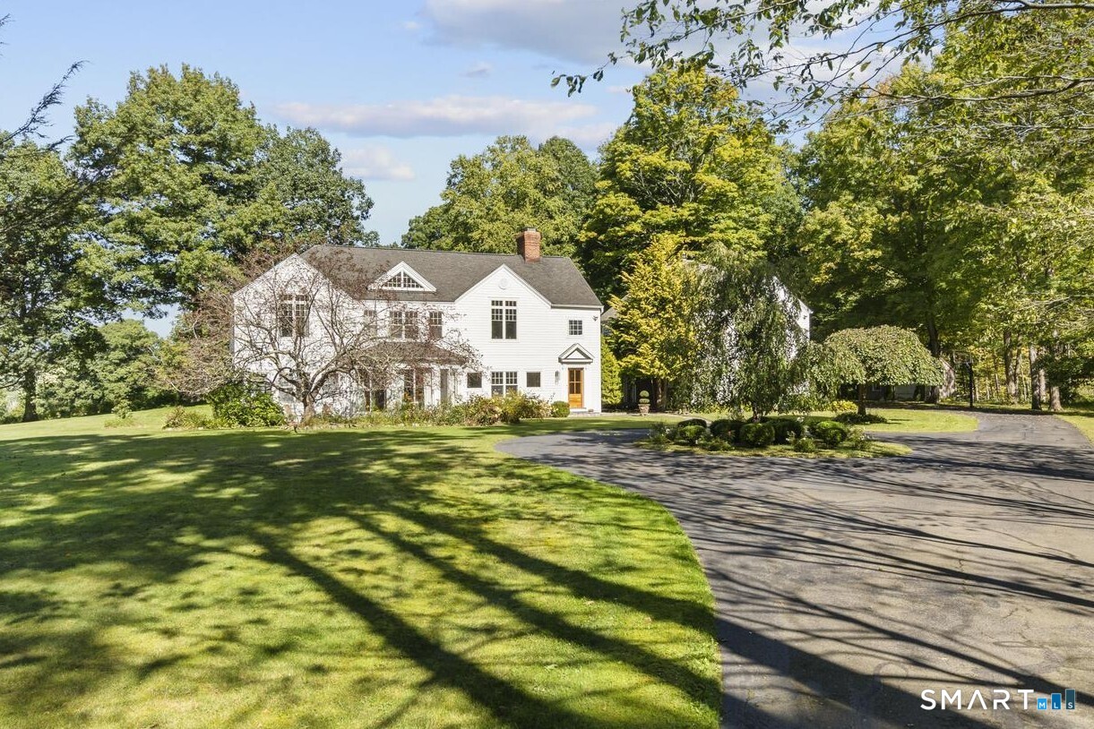 92 Quail Run Road Woodbury, CT 06798 - Photo 2 of 40 Circle driveway greets you with landscape tree entrance