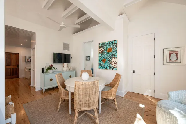 a bedroom with a bed and a large window with outer view