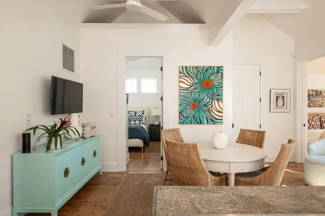 a bedroom with a bed and a large window with outer view