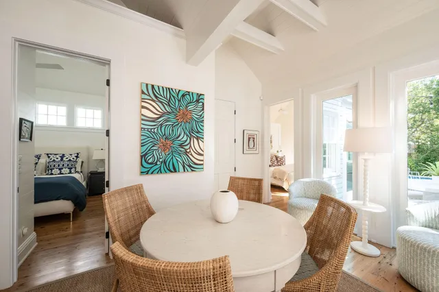 a bedroom with a bed and a large window with outer view