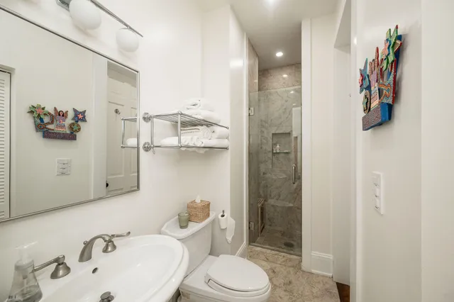 a view of a backyard with plants and outdoor seating