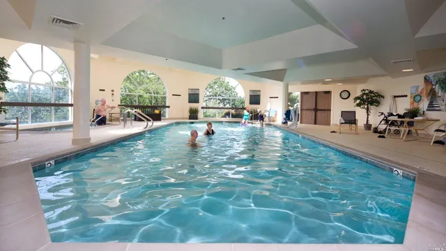 a view of a living room and bedroom
