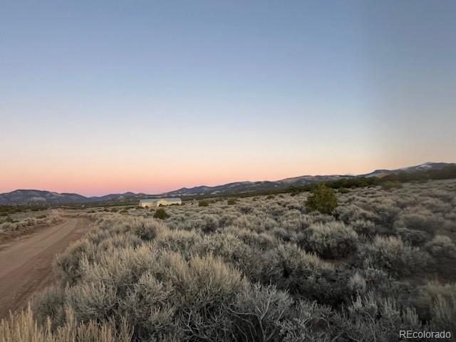 Lot 938 Bateman Road Fort Garland, CO 81133 - Photo 8 of 10 a view of a mountain range with trees in the background
