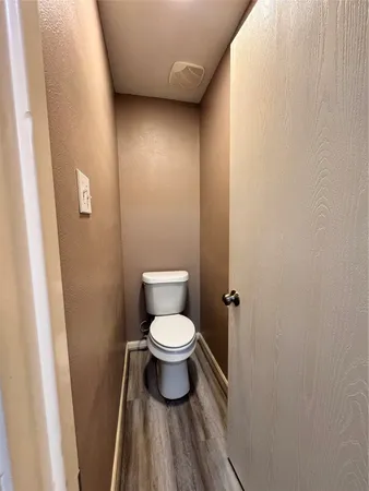 a bathroom with a toilet and a sink