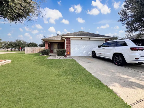 a view of a car parked in the yard