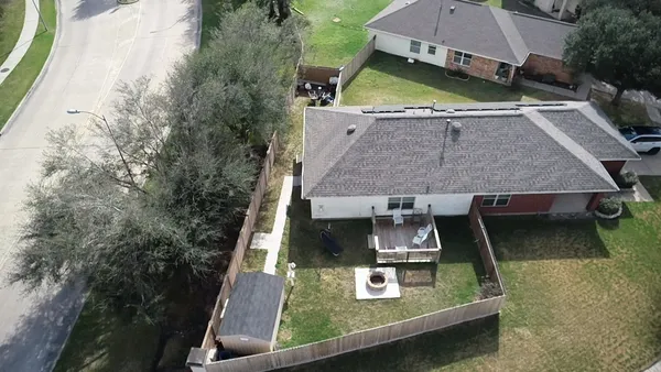 an aerial view of a house with swimming pool