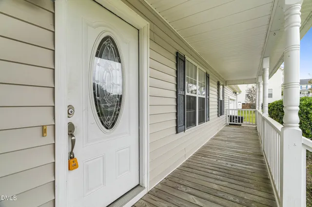 a view of a entryway door with wooden floor