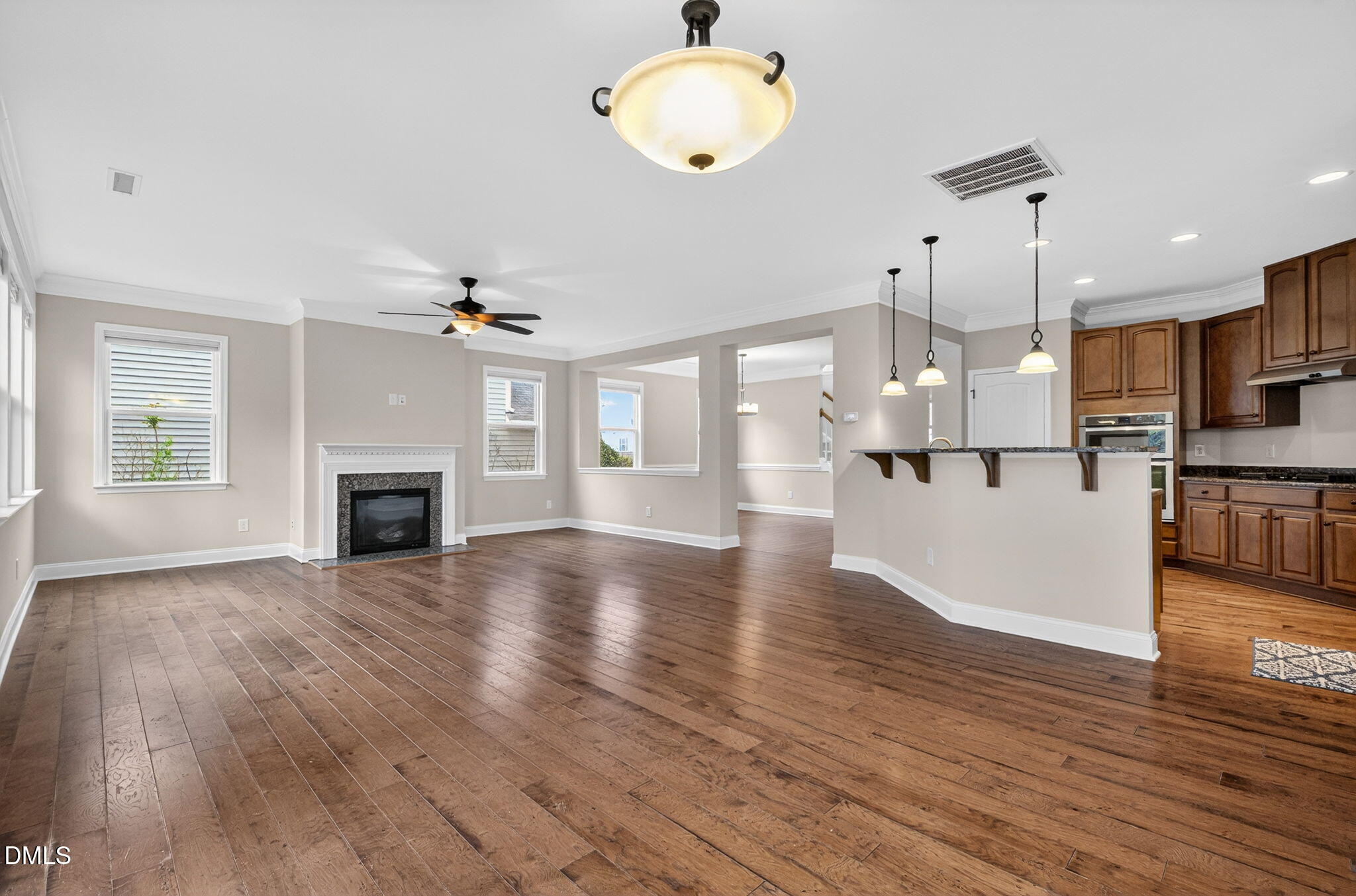 1304 Barnford Mill Road Wake Forest, NC 27587 - Photo 21 of 44 a view of a kitchen with a wooden floor and a kitchen