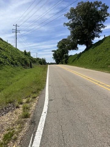 a sign board on the side of a road