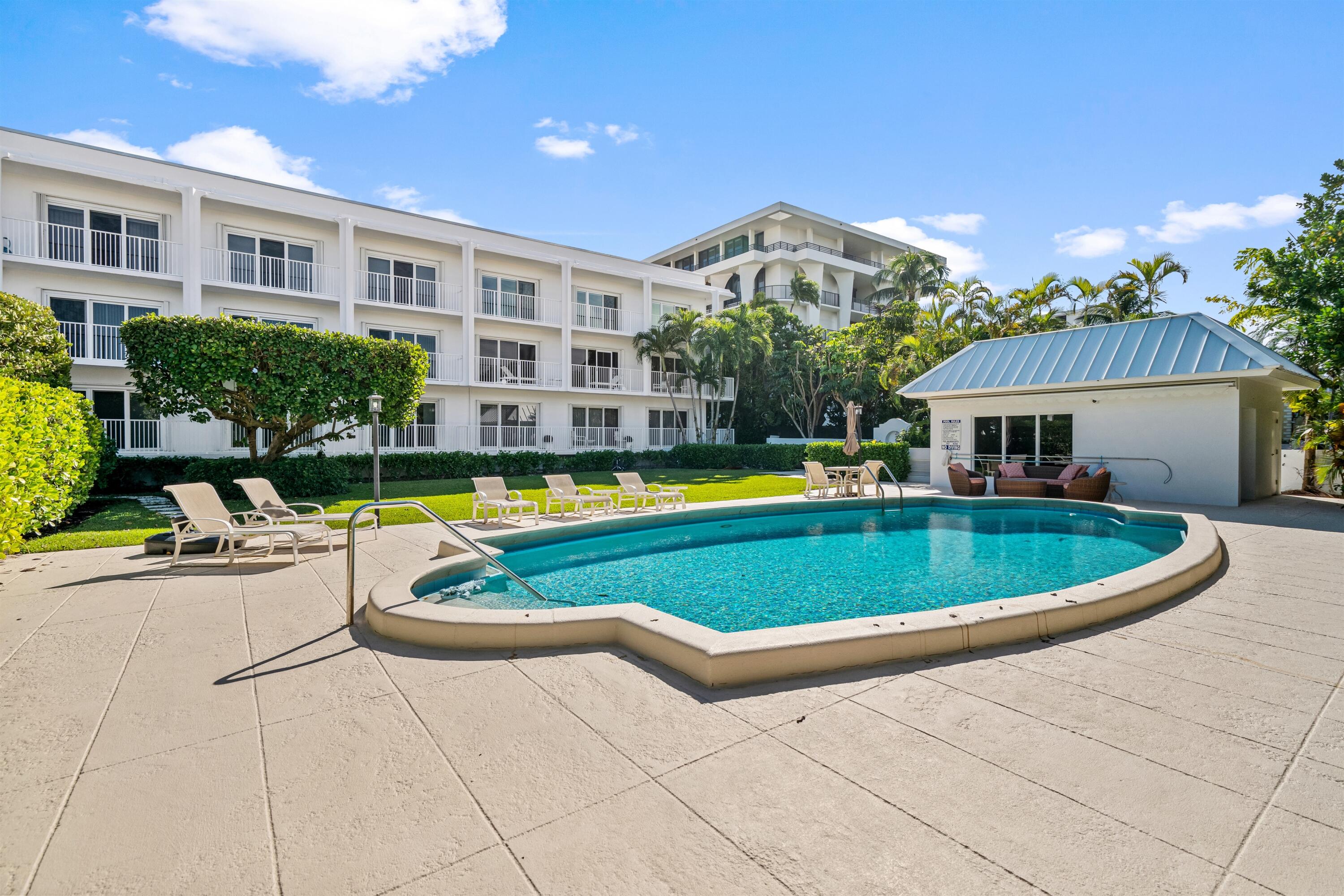 350 South Ocean Boulevard, Unit 204 Palm Beach, FL 33480 - Photo 4 of 5 a view of a house with swimming pool and sitting area