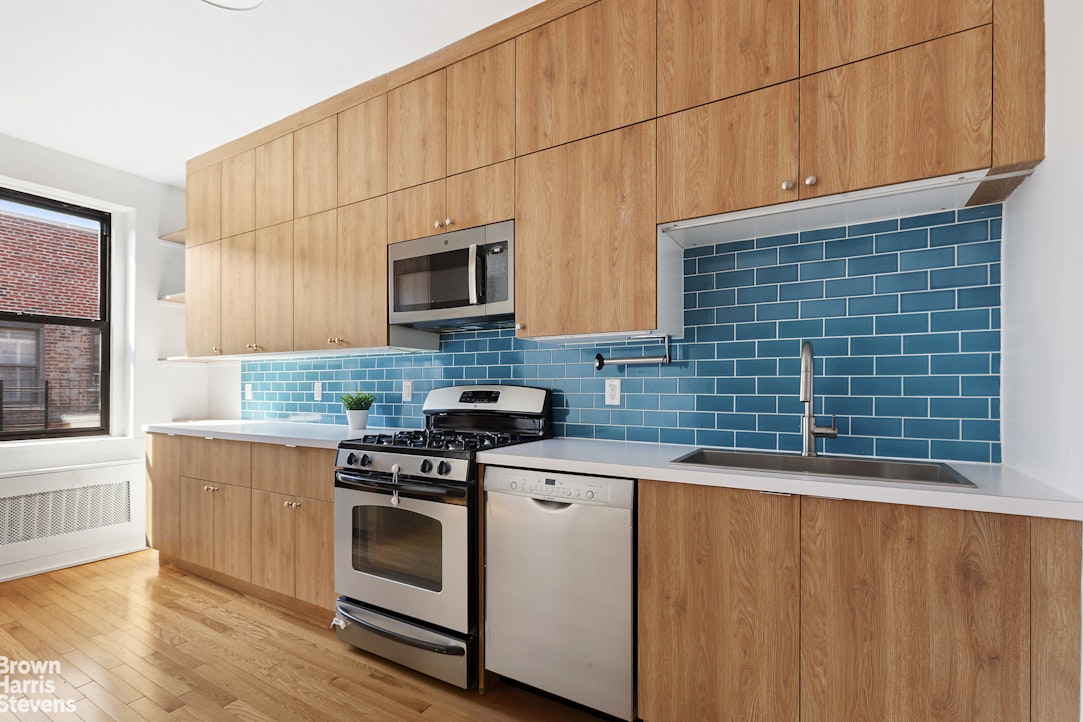 570 Westminster Road, Unit F16 Brooklyn, NY 11230 - Photo 1 of 7 a kitchen with stainless steel appliances wooden cabinets and a stove top oven