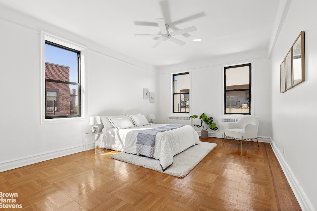 570 Westminster Road, Unit F16 Brooklyn, NY 11230 - Photo 2 of 7 a spacious bedroom with a large bed and a window
