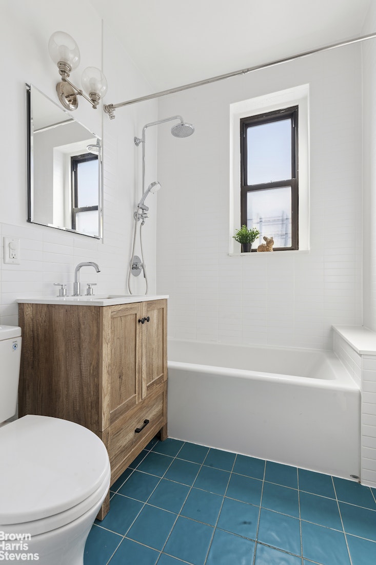 570 Westminster Road, Unit F16 Brooklyn, NY 11230 - Photo 3 of 7 a bathroom with a toilet a sink and bathtub