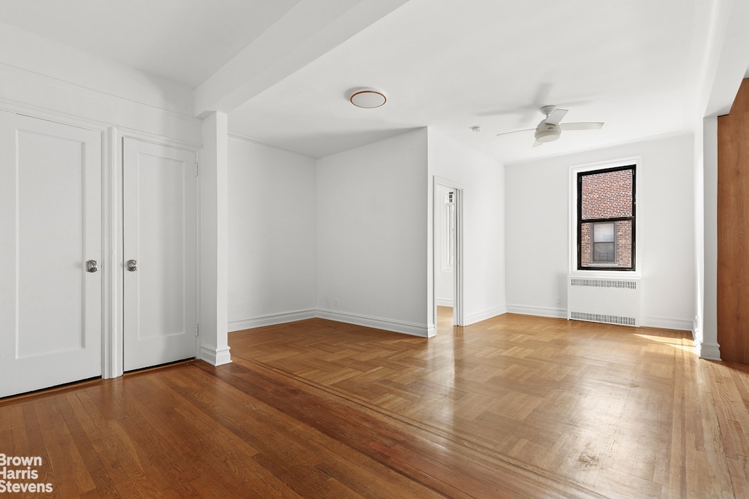 570 Westminster Road, Unit F16 Brooklyn, NY 11230 - Photo 4 of 7 a view of an empty room with window and wooden floor