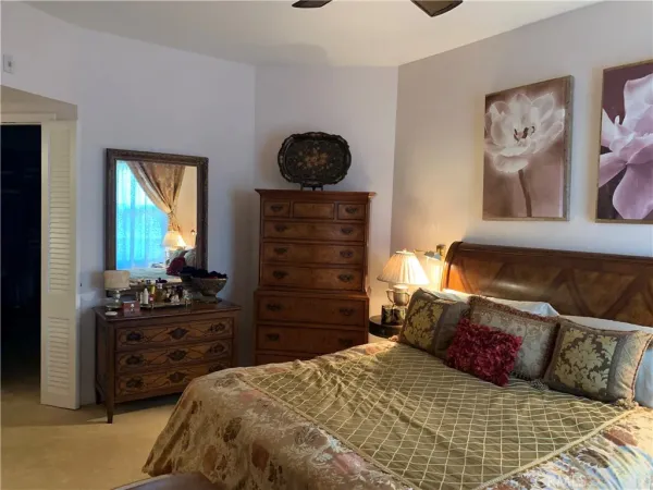 a bedroom with a bed and furniture