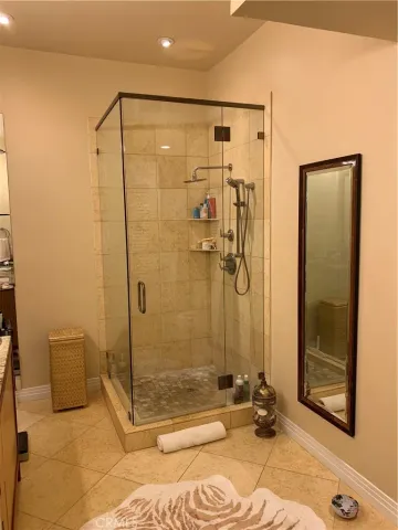a bathroom with a granite countertop sink a toilet and bathtub