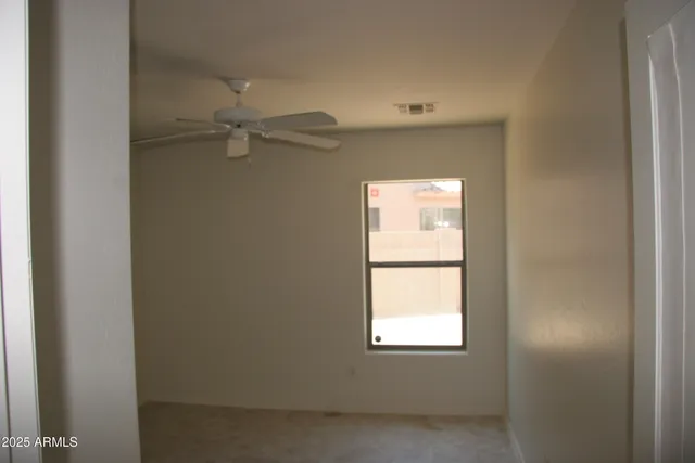 a view of a window in an empty room