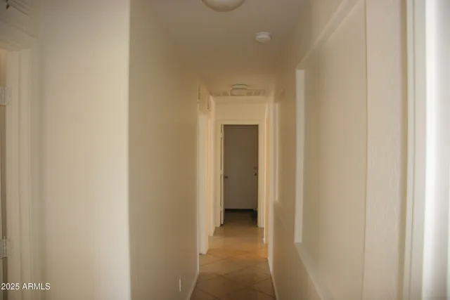 a view of a hallway with closet