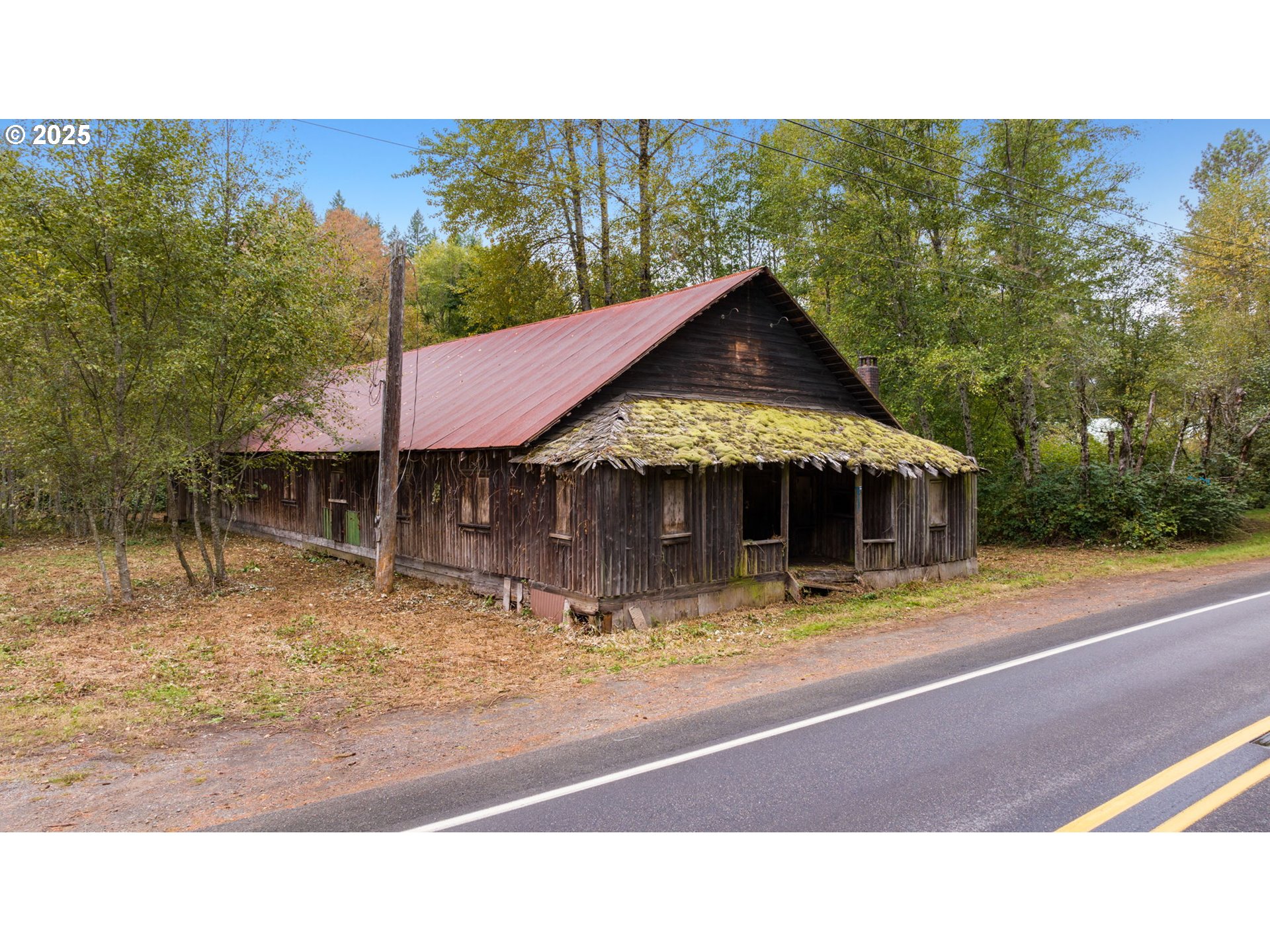 0 Northeast Yale Bridge Road Amboy, WA 98601 - Photo 1 of 28 a backyard of a house with table and chairs