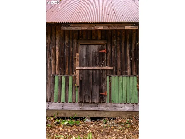 a view of a door with wooden fence