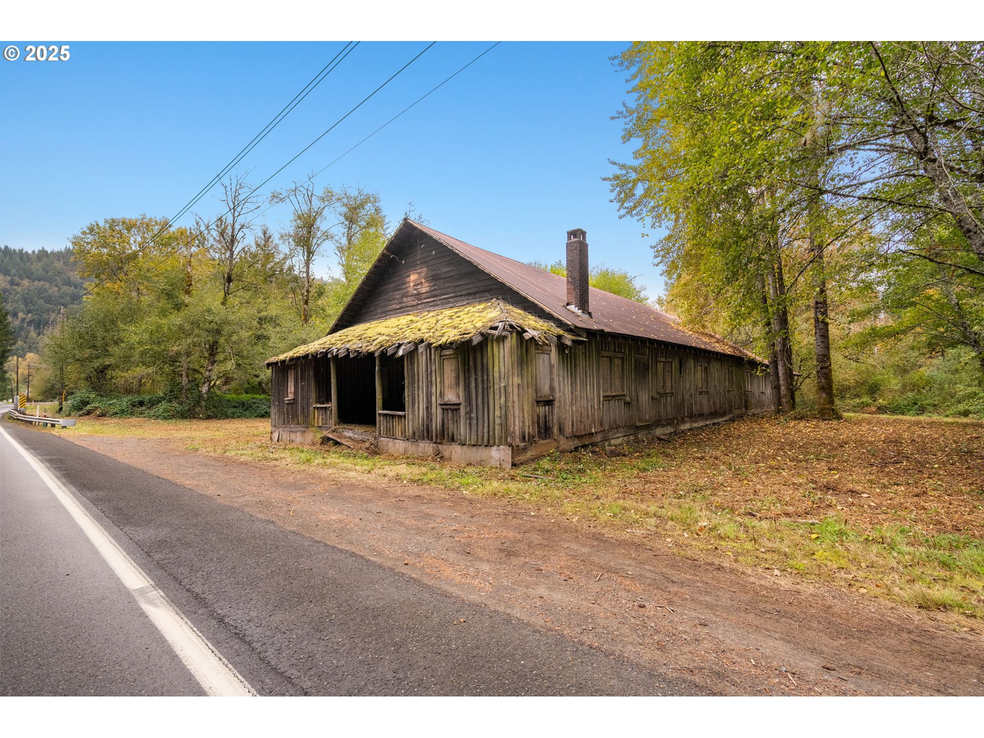 0 Northeast Yale Bridge Road Amboy, WA 98601 - Photo 20 of 28 a house with trees in the background