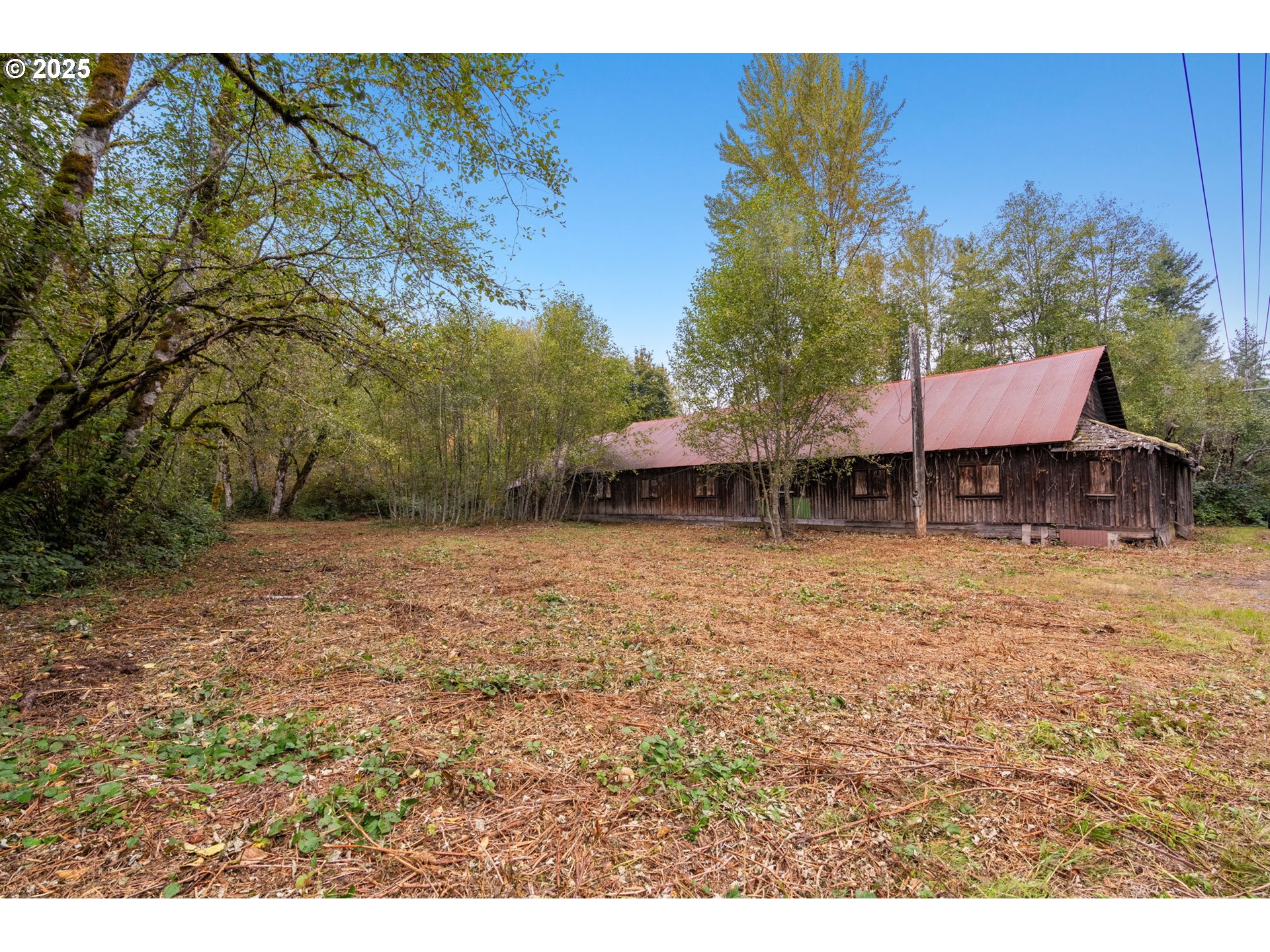 0 Northeast Yale Bridge Road Amboy, WA 98601 - Photo 21 of 28 a backyard of a house with table and chairs