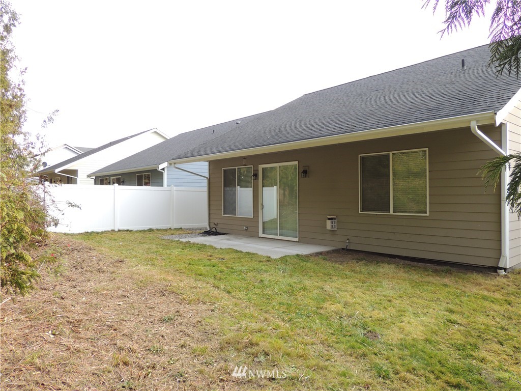 51 Pinehurst Loop Sequim, WA 98382 - Photo 2 of 24 a view of a house with backyard
