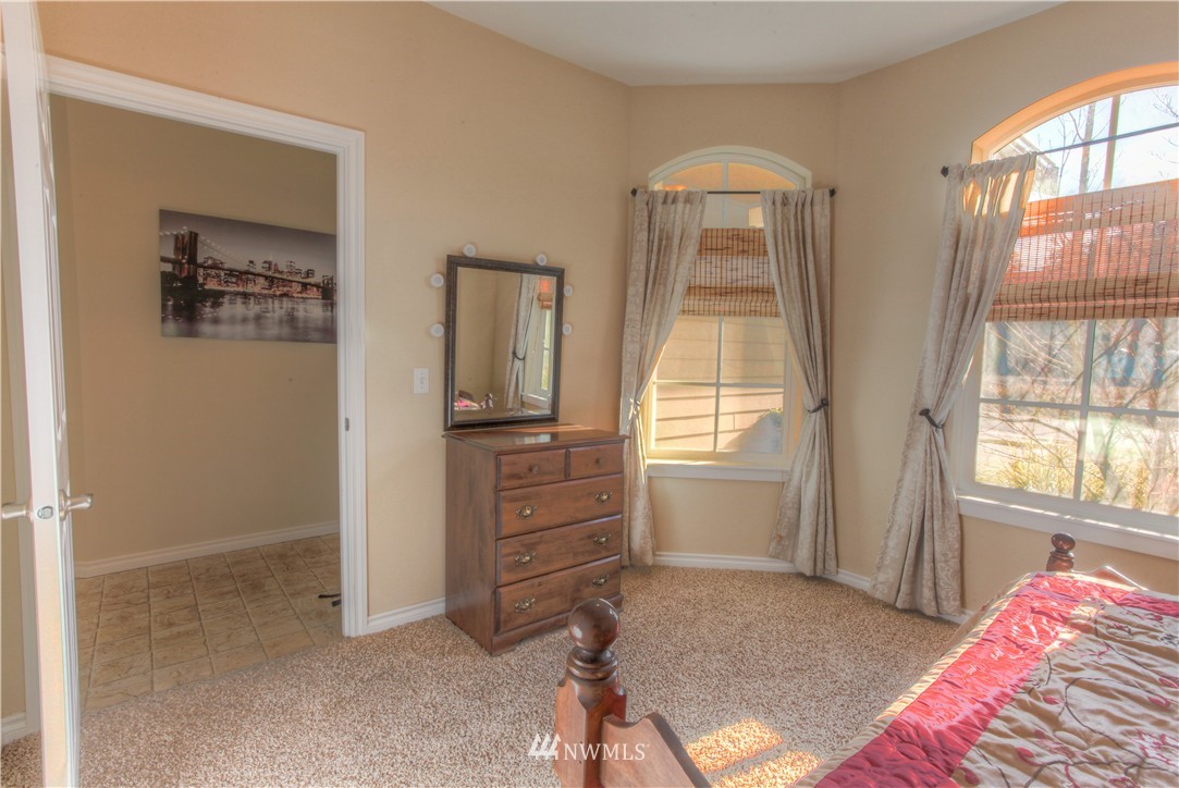 51 Pinehurst Loop Sequim, WA 98382 - Photo 11 of 24 a bedroom with a bed and a window