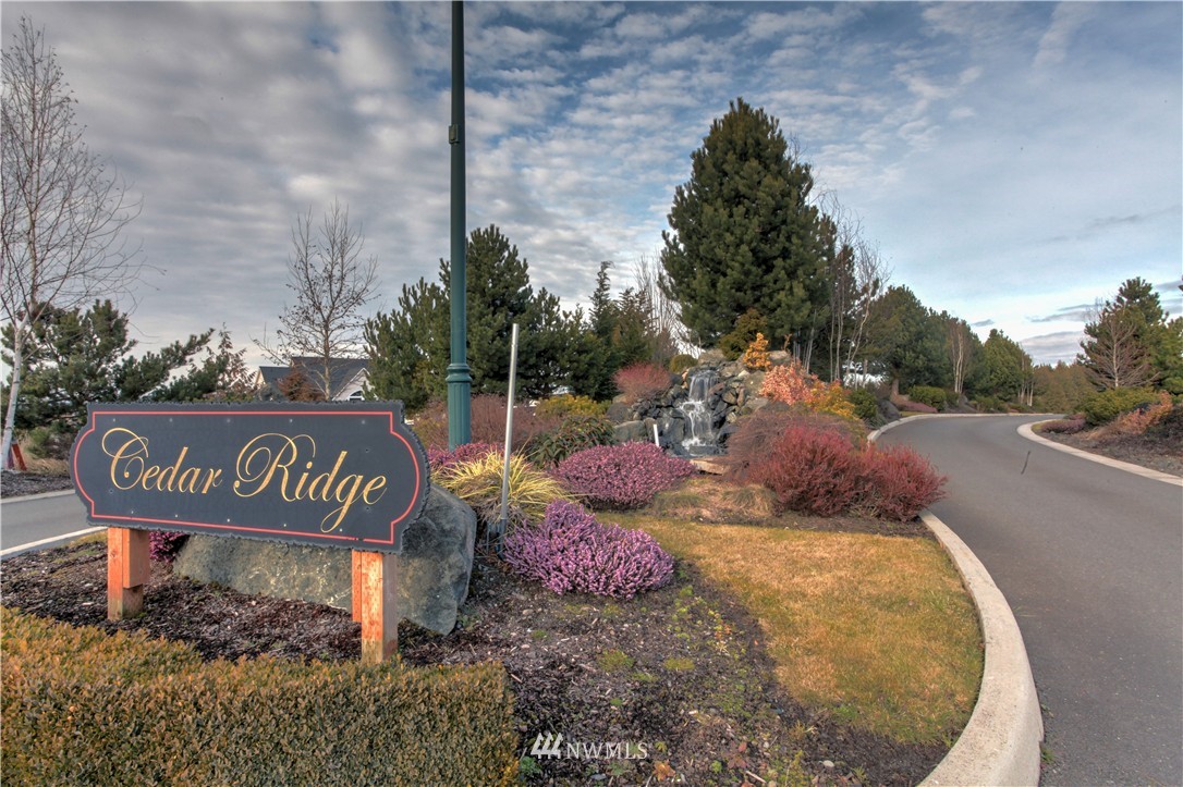 51 Pinehurst Loop Sequim, WA 98382 - Photo 15 of 24 a sign that is sitting on a brick wall