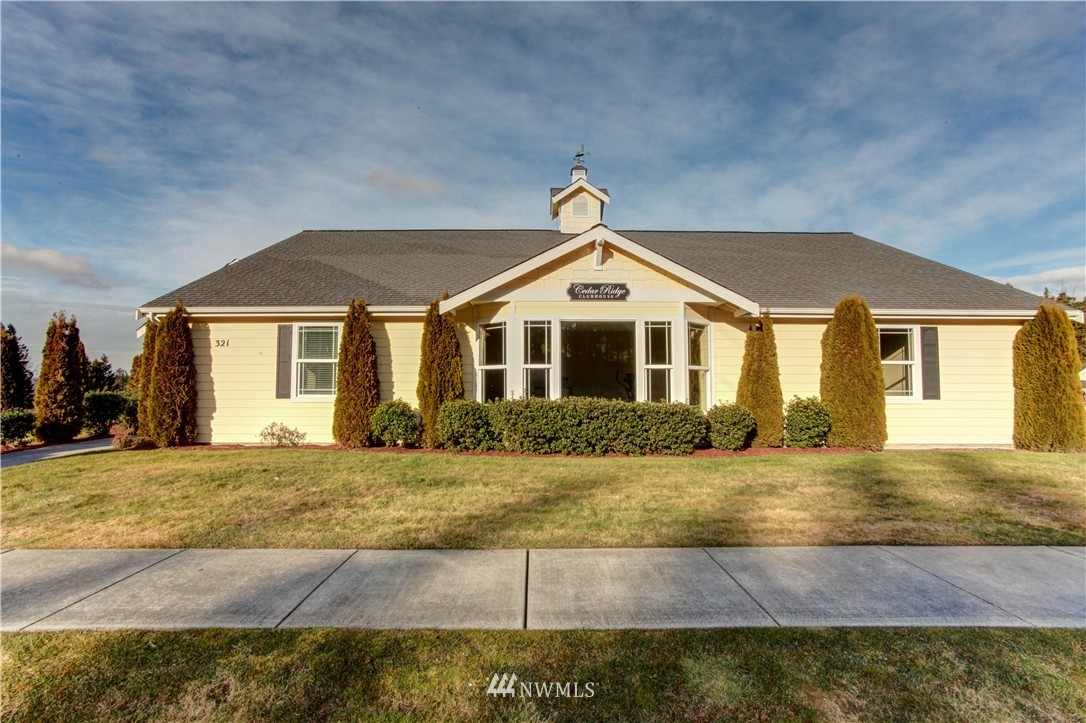 51 Pinehurst Loop Sequim, WA 98382 - Photo 16 of 24 a front view of a house with a yard